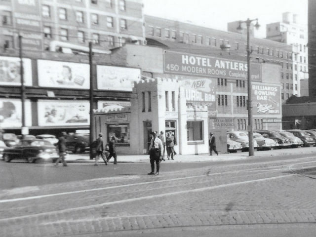 The Antlers Hotel rising behind a White Tower restaurant