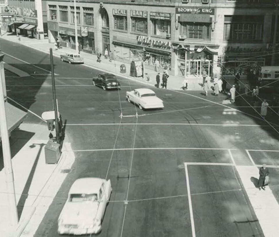 Street view showing the Empire Lounge, 1957.
