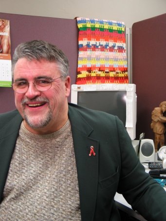 "I tell people AIDS chose me." Mike Fitzpatrick is a dedicated social worker and a determined activist. He began caring for people with AIDS in 1984, motivating him to become a grassroots activist. He provided the leadership that created the Central Wisconsin AIDS Support Group, one of Wisconsin�s first groups providing help to people living with AIDS. "I did this because no one else would. People I loved were dying of this disease." Fitzpatrick�s work in the early days of the AIDS epidemic established Wisconsin�s historic commitment that everyone with HIV, regardless of where they live, would get the care and treatment they need. Over the years, he has cared for hundreds of people with HIV disease in Greater Wisconsin. "Early in the epidemic the roads were not paved and we were beating our own paths. There was this sense that we were at war and we were in our encampment. We set up tents, not thinking the war would be permanent, always thinking we would be going home soon." Fitzpatrick continues his activism against AIDS as a bilingual social work case manager for the AIDS Resource Center of Wisconsin in Green Bay. He is an advocate and confidant for people with HIV and AIDS in Greater Wisconsin, working every day to make their lives better. "This job is the perfect fit. I returned to school to do this work so I could help others. I�ve never looked back."