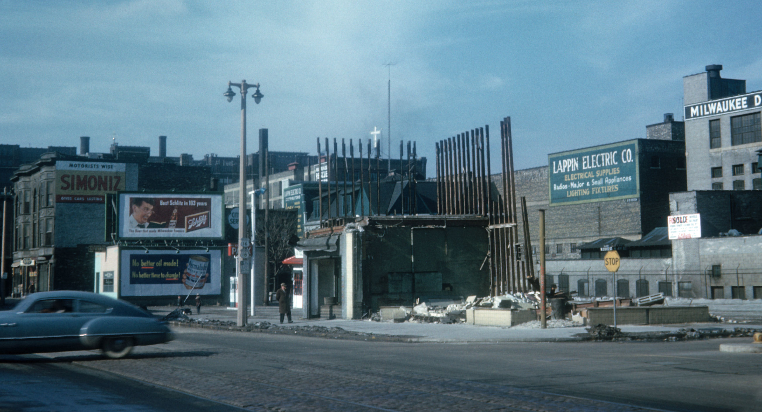 The Mint Bar, the last building on its block, during demolition in 1986.