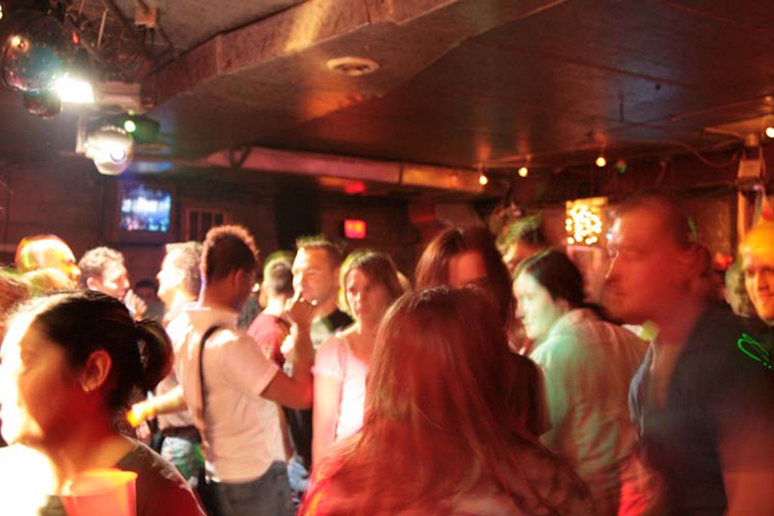 A packed dance floor at the bar.