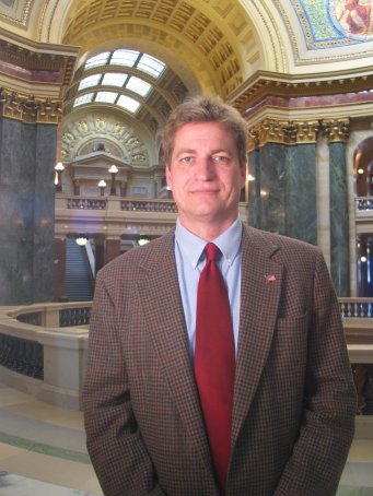 Advocacy has always been at the heart of the fight against AIDS. Since his election to the State Legislature from Milwaukee in l984, State Senator Tim Carpenter has personified effective AIDS advocacy. Educating in the face of ignorance and fighting discrimination in the face of prejudice, Carpenter works tirelessly on behalf of people with HIV and AIDS. "I remember when I was a little kid that many people lost family and friends in the Vietnam War. AIDS is my generation�s war that continues to claim so many talented and wonderful people who we will never get back." Carpenter�s inspired AIDS advocacy has created state policies that ban HIV discrimination in health care and provide funding for AIDS prevention, care and treatment services throughout all of Wisconsin. "Health care systems always change. It�s important to me that as these changes occur we make sure that people who are most in need get the care they deserve." As a public official who embraced HIV education, prevention and treatment early on, Senator Carpenter continues to make Wisconsin a national leader in response to AIDS. "We�ve come a long way in 20 years, but many challenges remain and my commitment to the fight against AIDS is stronger than ever."